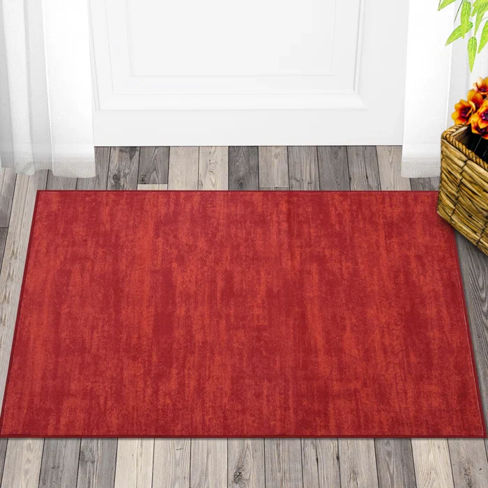 Ellicia Solid Color Polyester Area Rug in Red/Orange 2' x 3'